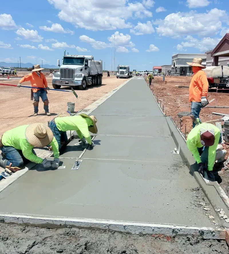 Concrete sidewalk finishing in progress
